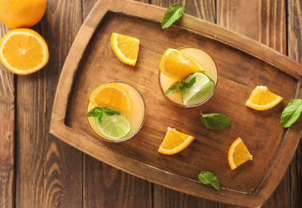 Fresh summer cocktail in glasses on wooden board — Stock Photo, Image