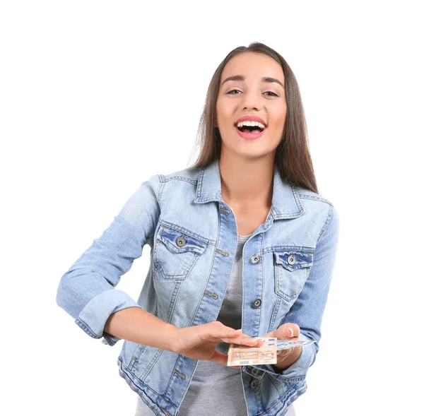 Young woman throwing money on white background — Stock Photo, Image