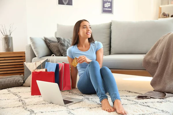 Happy young woman after online shopping at home — Stock Photo, Image