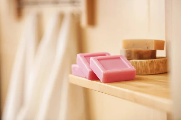 Soap bars on shelf in bathroom — Stock Photo, Image