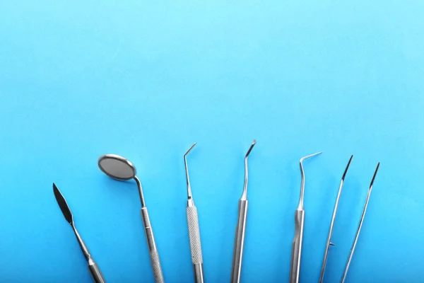 Dentist's tools on color background — Stock Photo, Image