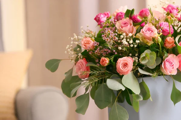 Gift box with beautiful flowers indoors — Stock Photo, Image