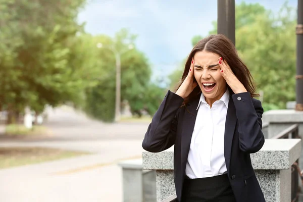 Beautiful stressed businesswoman outdoors — Stock Photo, Image