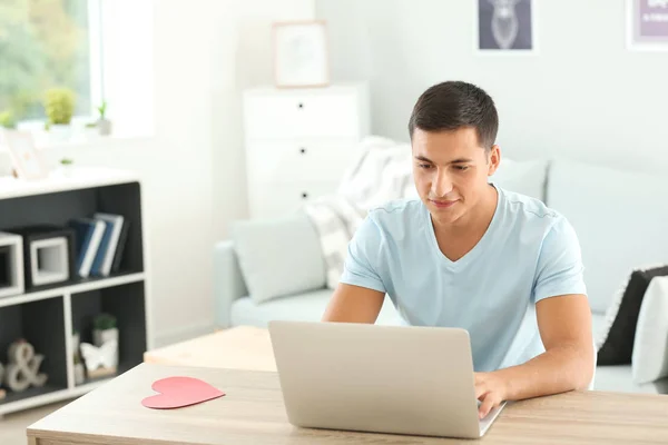 Young man having online dating at home — Stock Photo, Image