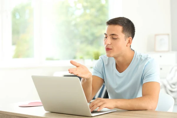 Young man having online dating at home — Stock Photo, Image