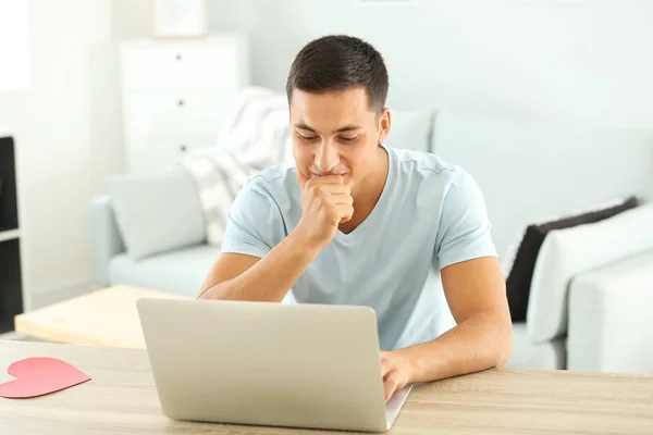 Young man having online dating at home — Stock Photo, Image