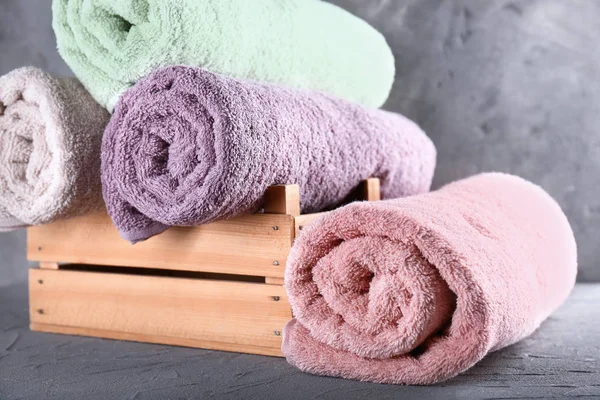 Clean soft towels on grey table — Stock Photo, Image