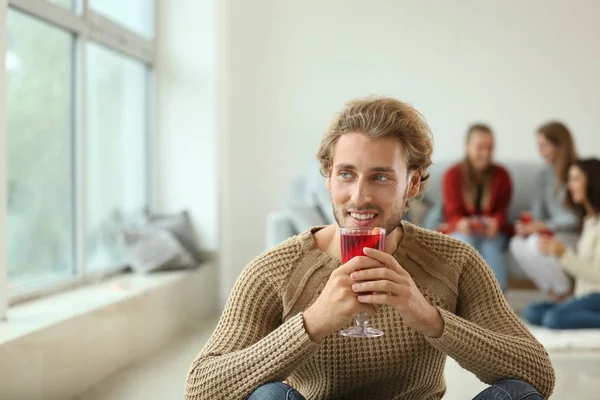 Man with delicious mulled wine at party — Stock Photo, Image