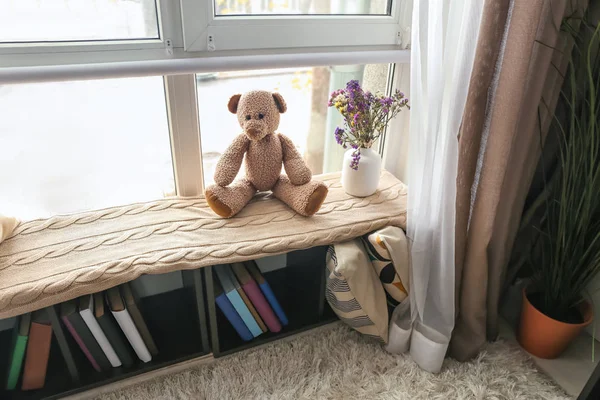 Cozy place for rest with book shelf near window in room — Stock Photo, Image