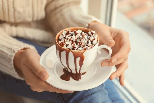 Woman holding cup of hot chocolate with marshmallows, closeup — Stock Photo, Image