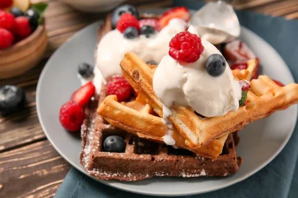 Delicious waffles with berries and ice cream on plate — Stock Photo, Image
