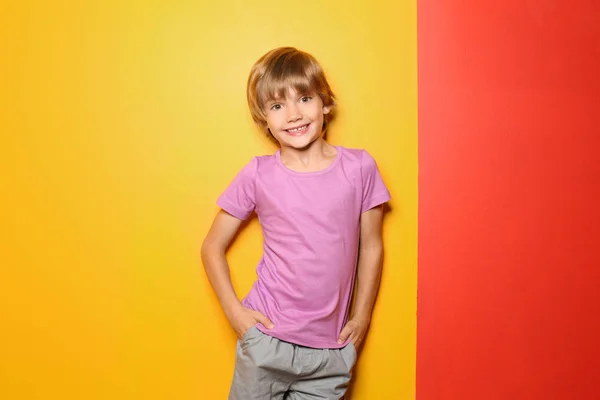Little boy in t-shirt on color background — Stock Photo, Image