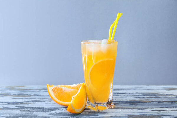 Fresh summer cocktail in glass on wooden table