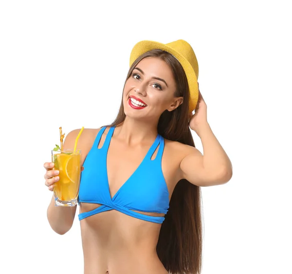 Beautiful woman in swimming suit and with tasty summer cocktail on white background — Stock Photo, Image