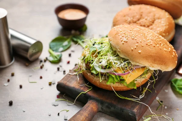 Tasty burgers on table — Stock Photo, Image