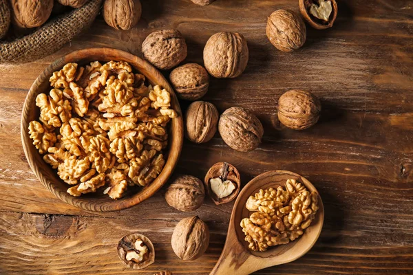 Tasty walnuts on wooden table — Stock Photo, Image