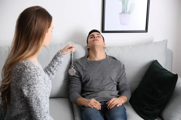 Young man during hypnosis session in psychologist's office — Stock Photo, Image