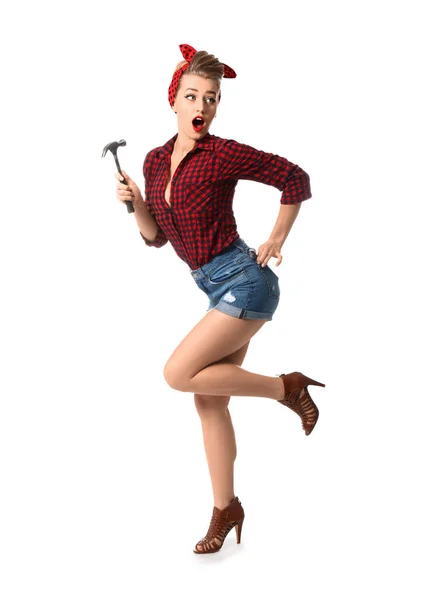 Surprised pin-up woman with hammer on white background — Stock Photo, Image