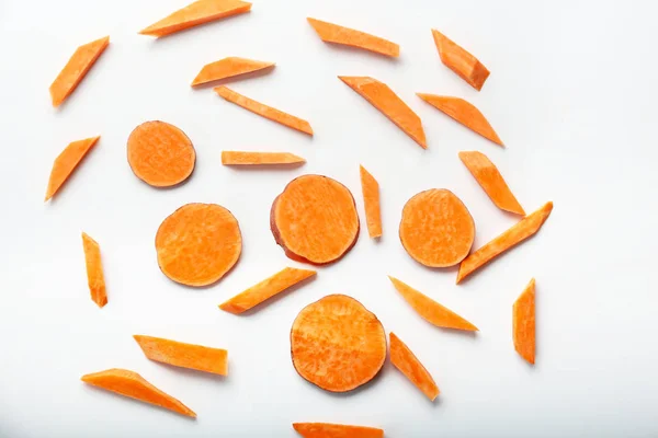 Cut sweet potato on white background — Stock Photo, Image