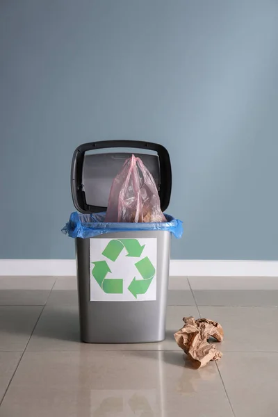 Trash bin with garbage indoors. Recycling concept — Stock Photo, Image