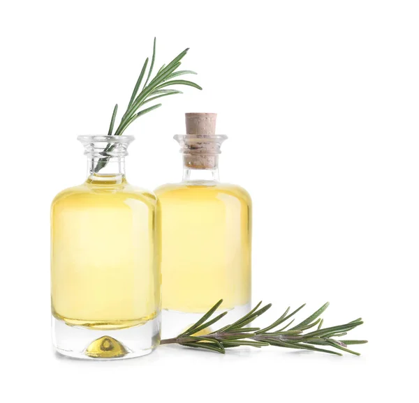 Bottles with rosemary oil on white background — Stock Photo, Image
