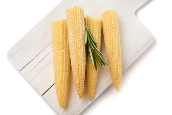 Board with baby corn cobs on white background — Stock Photo, Image
