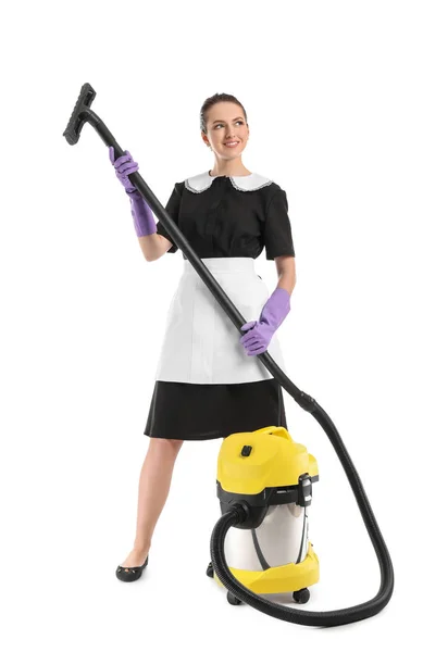 Portrait of beautiful female housekeeper with vacuum cleaner on white background — Stock Photo, Image