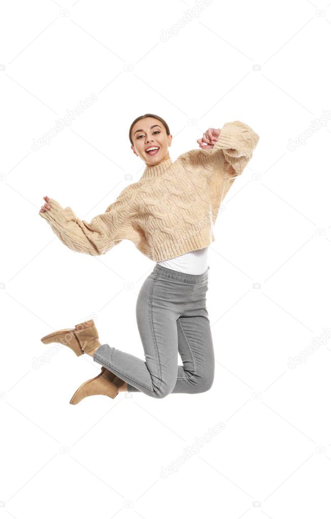 Happy jumping woman on white background