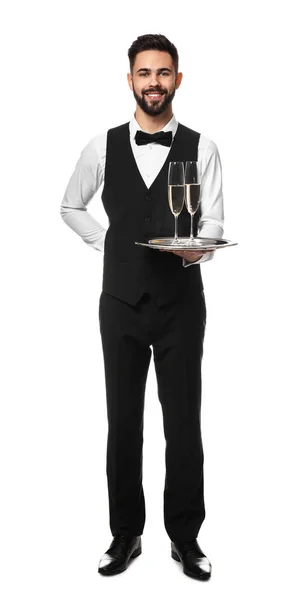 Knappe kelner met glazen champagne op witte achtergrond — Stockfoto