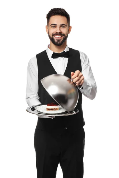 Schöner Kellner mit leckerem Dessert auf weißem Hintergrund — Stockfoto