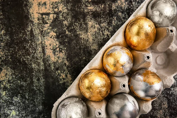 Holder with beautiful Easter eggs on dark background — Stock Photo, Image