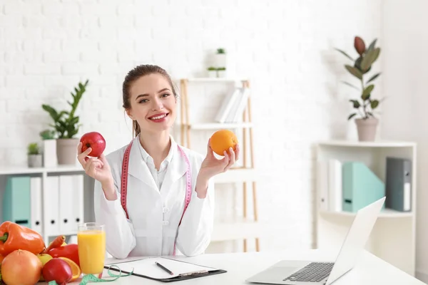 Portrait of female nutritionist in her office — Stock Photo, Image