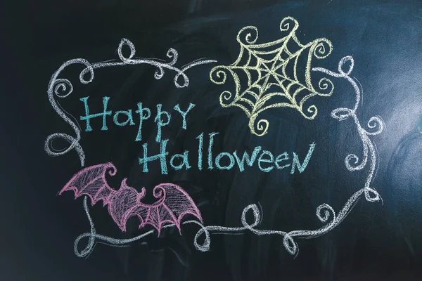 Dessins avec le texte "Joyeux Halloween" sur fond sombre — Photo