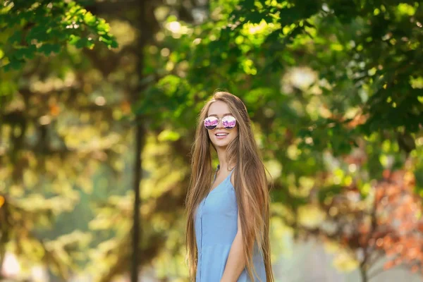 Beautiful young woman resting outdoors — Stock Photo, Image