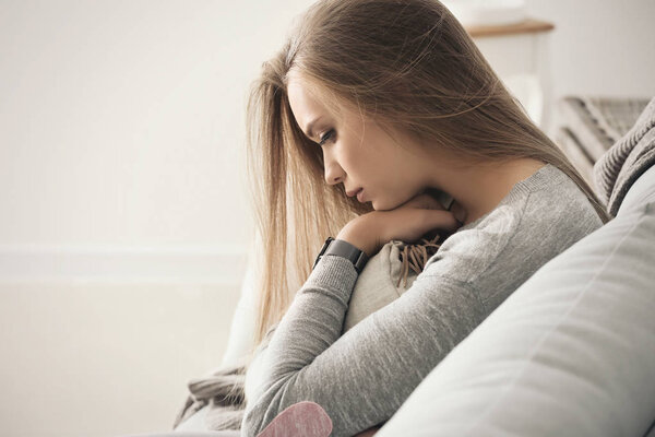 Lonely woman suffering from depression at home