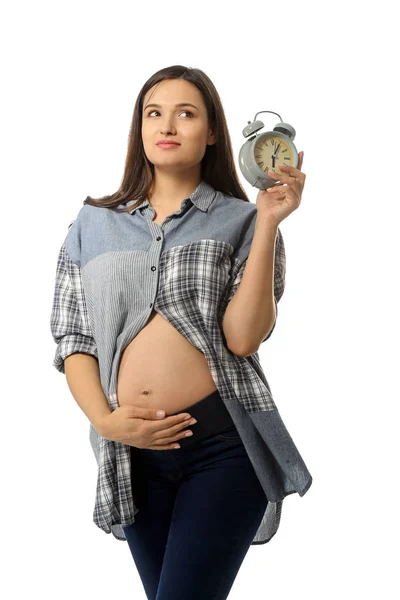 Bella donna incinta con orologio su sfondo bianco — Foto Stock