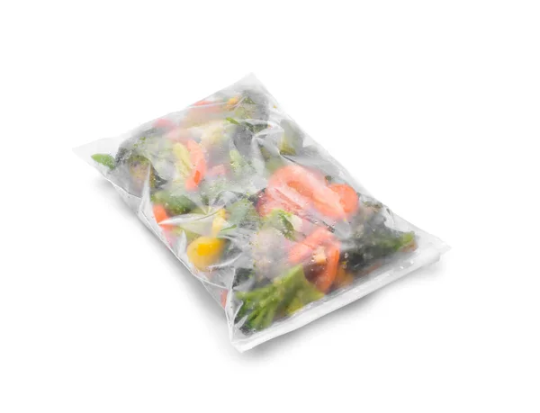 Plastic bag with frozen vegetables on white background — Stock Photo, Image