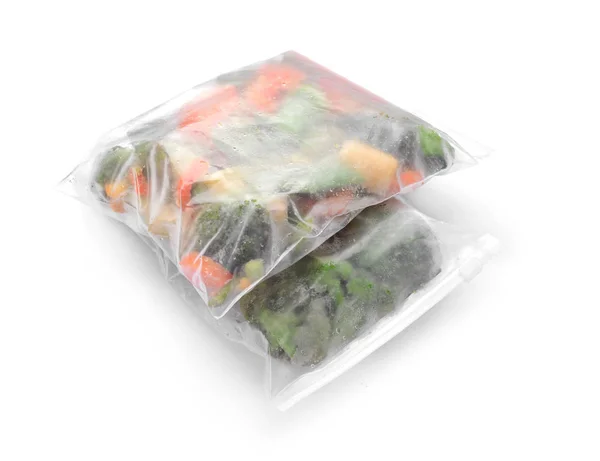 Plastic bags with frozen vegetables on white background — Stock Photo, Image