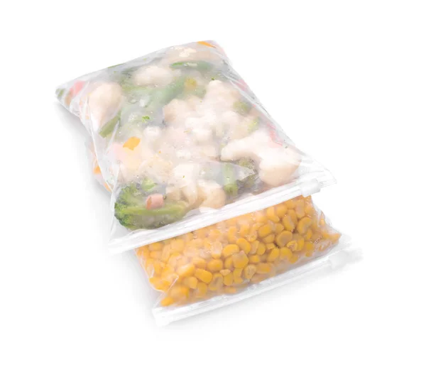 Plastic bags with frozen vegetables on white background — Stock Photo, Image