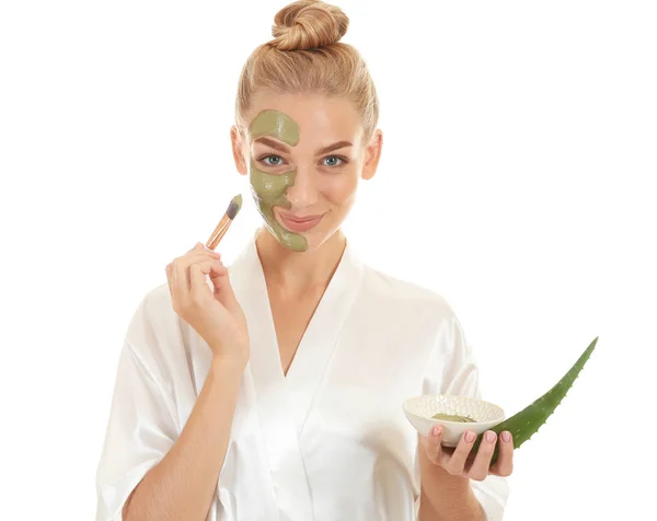 Beautiful young woman with facial mask containing aloe vera extract, on white background — Stock Photo, Image