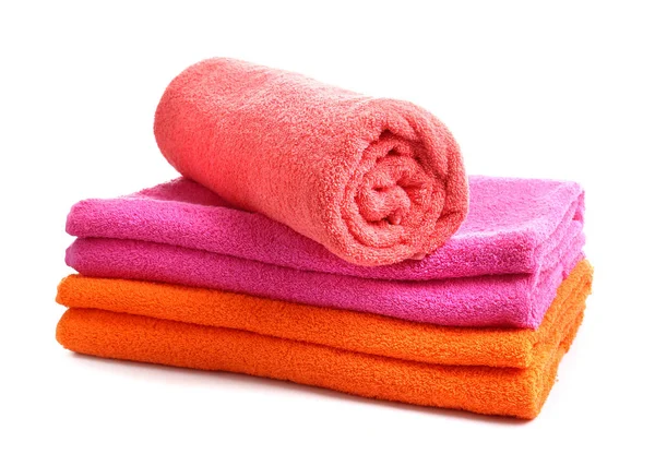 Stack of bright towels on white background — Stock Photo, Image