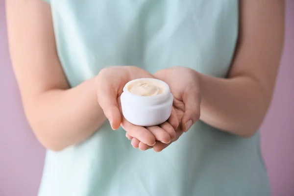 Woman holding jar of body cream, closeup — Stock Photo, Image