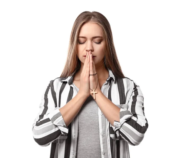 Красива молода жінка молиться на білому тлі — стокове фото