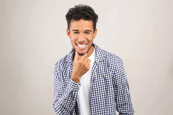 Portrait of happy African-American man on light background — Stock Photo, Image