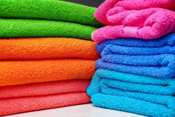 Stack of bright clean towels, closeup — Stock Photo, Image