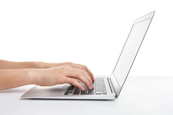 Young woman using laptop on white background — Stock Photo, Image