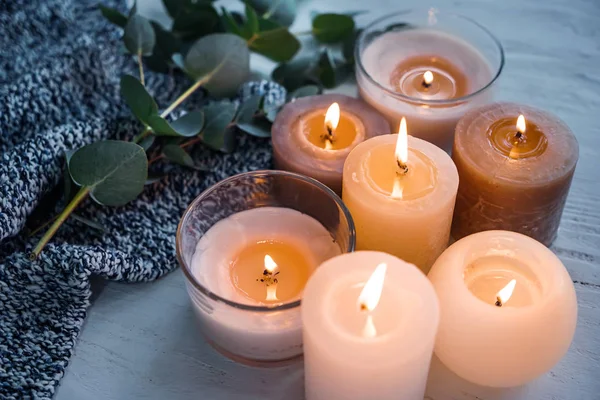 Beautiful burning candles on wooden table — Stock Photo, Image