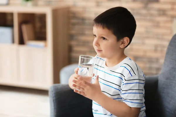 Little boy with glass of fresh water at home — Stock Photo, Image