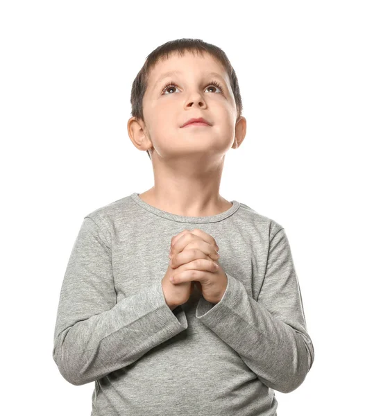 Little boy praying on white background — Stock Photo, Image