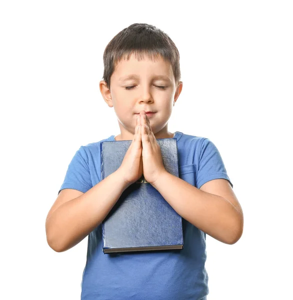 Little boy with Bible praying on white background — Stock Photo, Image